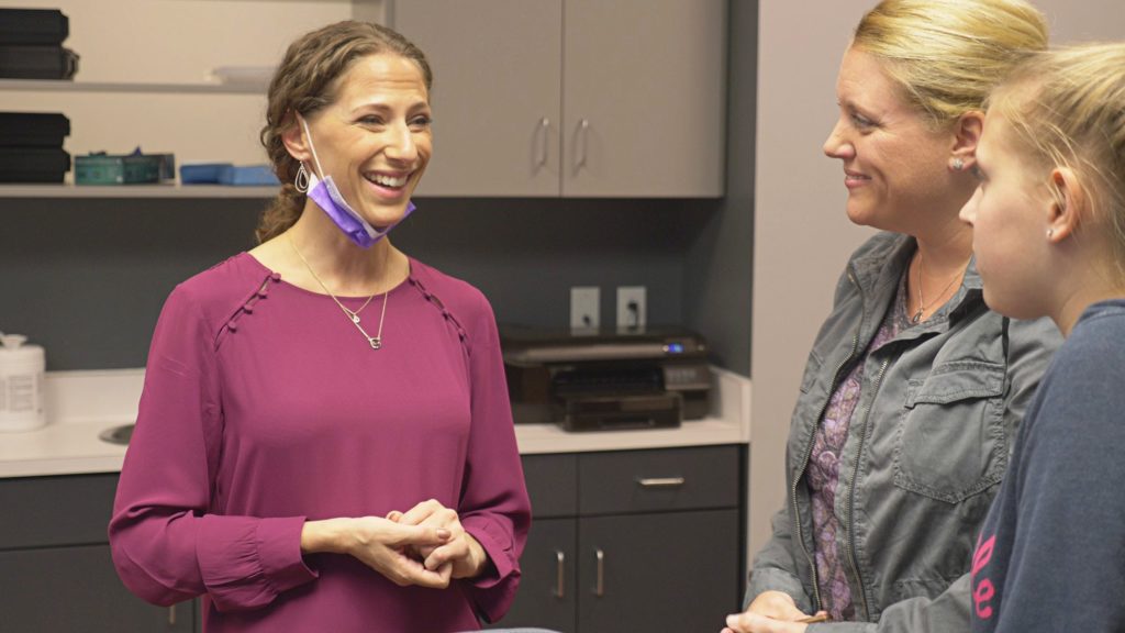 Dr. Rhoads with patients