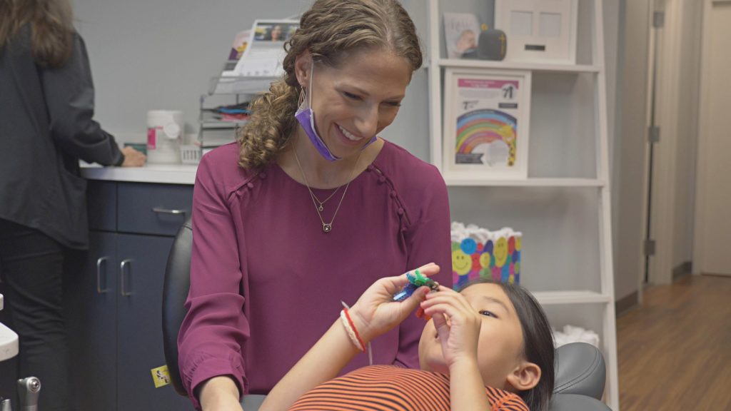 Dr. Rhoads with a patient